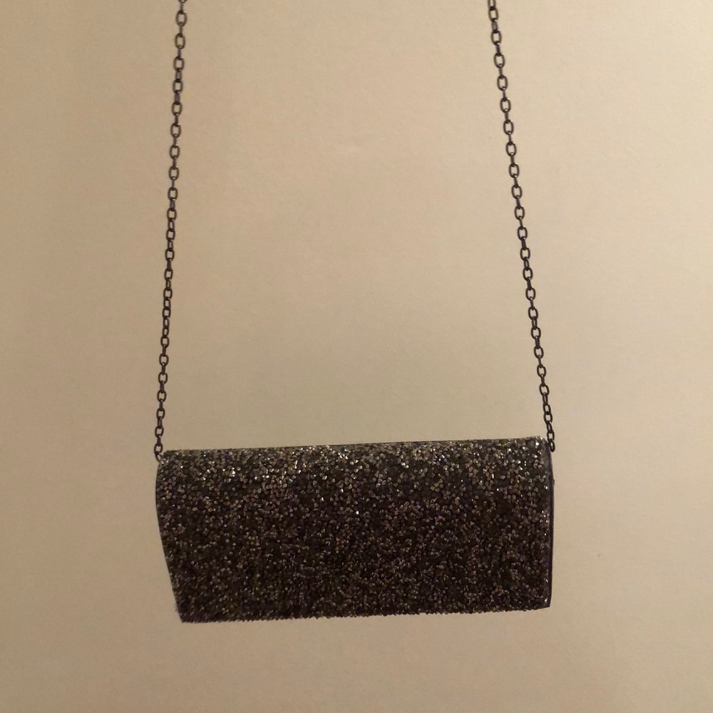 Gunmetal colored clutch with strap